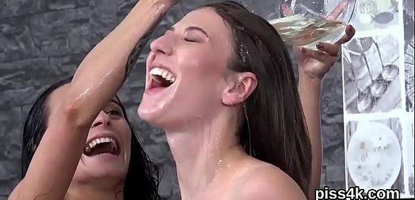 Sensual lesbian sweeties get splashed with piss and squirt wet vaginas